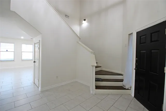 a view of entryway and hall with a window