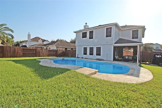 a view of a house with a swimming pool