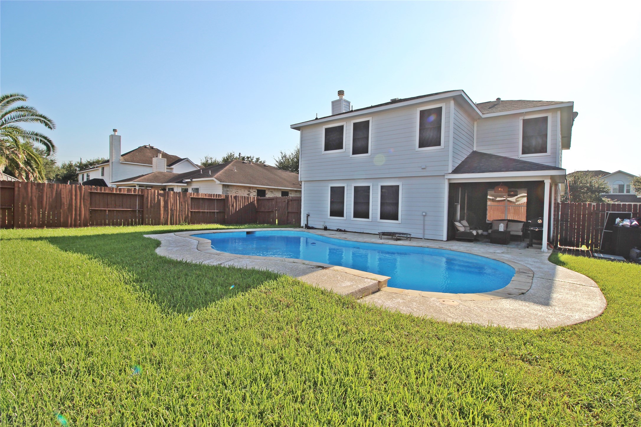 8314 Silver Fir Lane Baytown, TX 77523 - Photo 20 of 22 a view of a house with a swimming pool