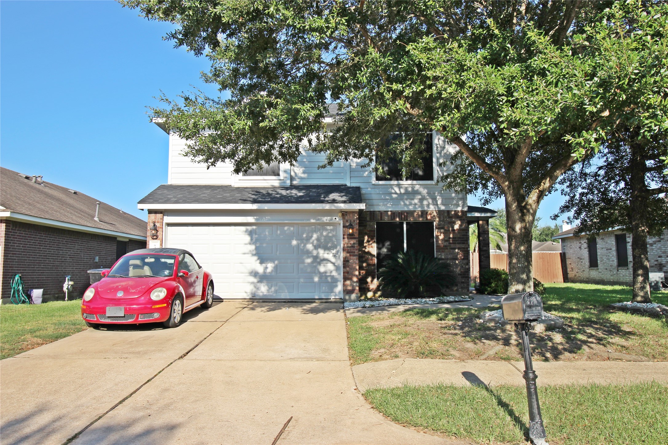 8314 Silver Fir Lane Baytown, TX 77523 - Photo 2 of 22 a front view of a house with a yard