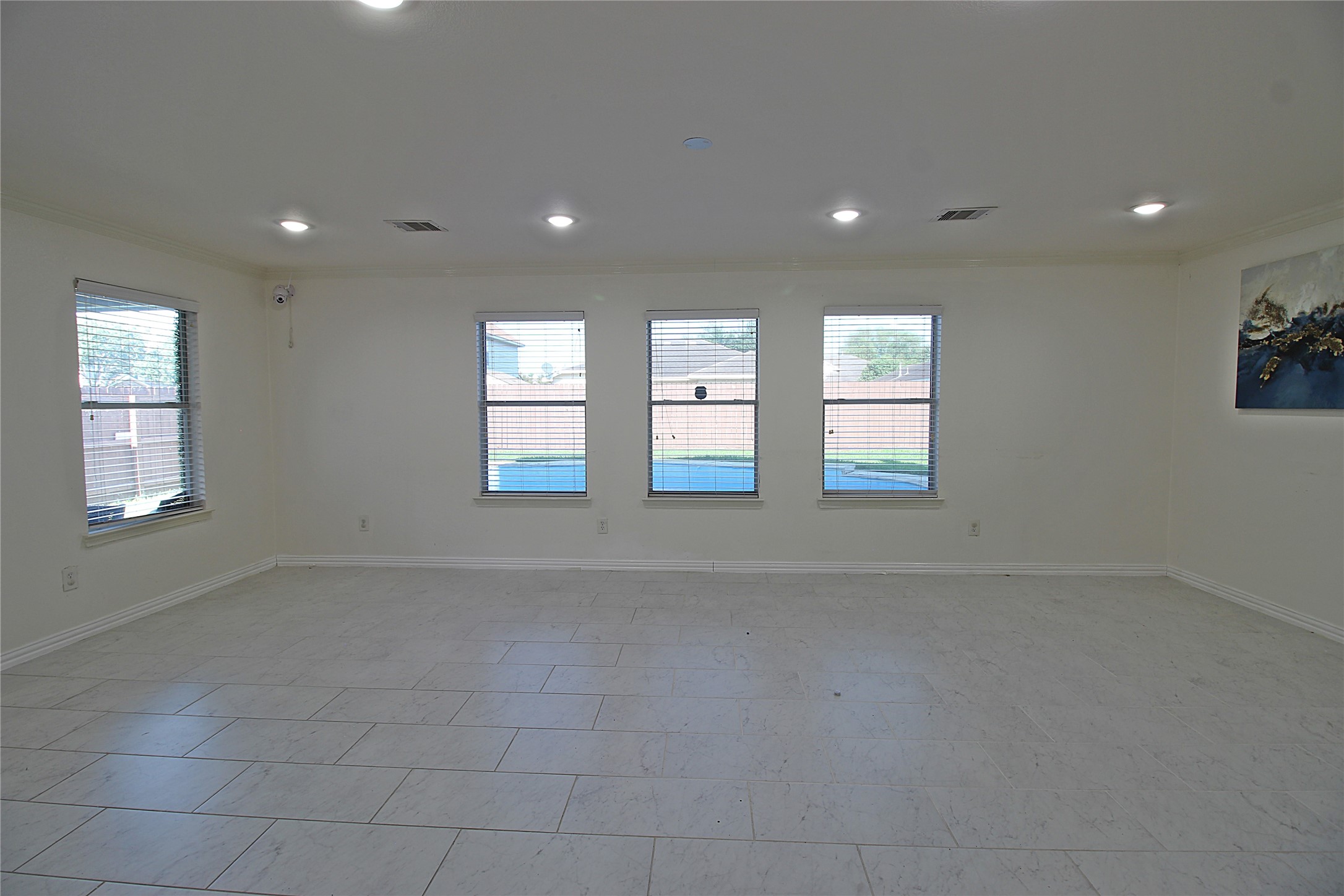 8314 Silver Fir Lane Baytown, TX 77523 - Photo 6 of 22 a view of an empty room with windows
