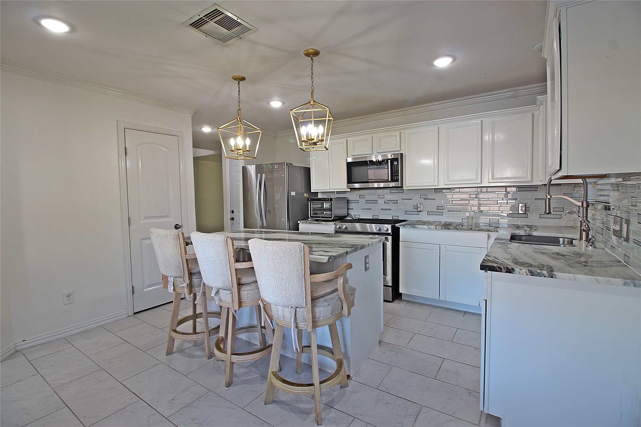 8314 Silver Fir Lane Baytown, TX 77523 - Photo 8 of 22 a kitchen with a sink cabinets and window