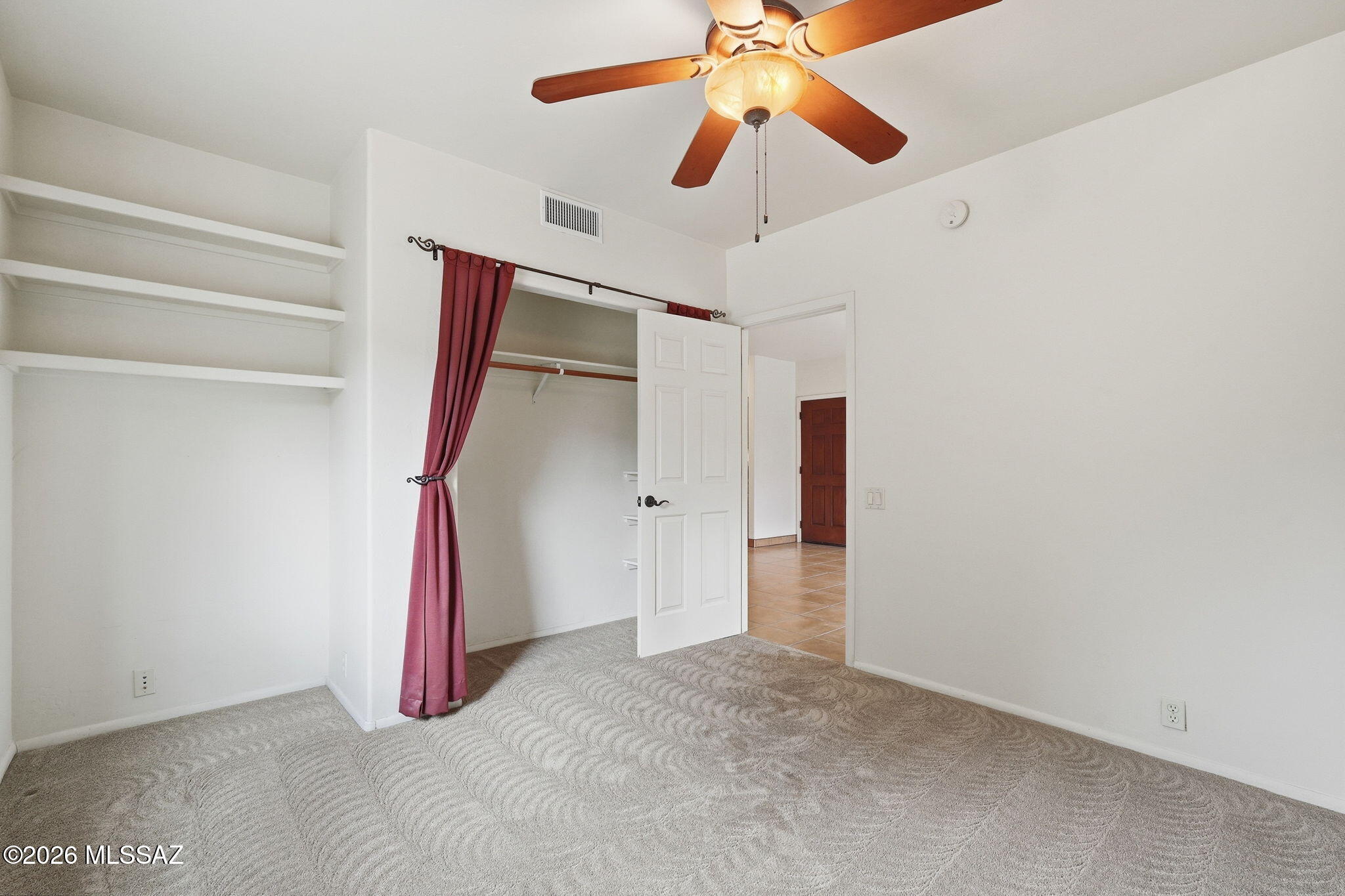 1125 East Kleindale Road Tucson, AZ 85719 - Photo 40 of 49 a view of a room with a ceiling fan