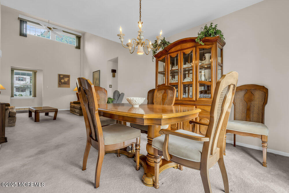 15 Rita Drive Howell, NJ 07731 - Photo 11 of 26 a dining room with furniture and chandelier