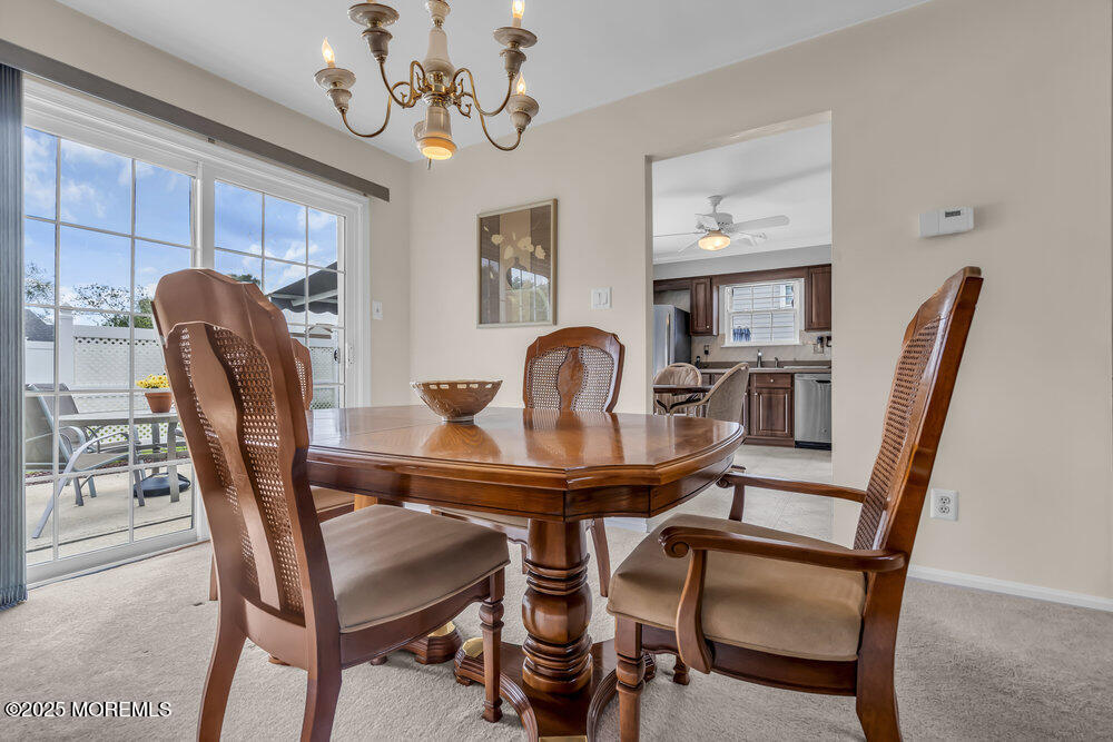 15 Rita Drive Howell, NJ 07731 - Photo 12 of 26 a view of a dining room with furniture and a chandelier