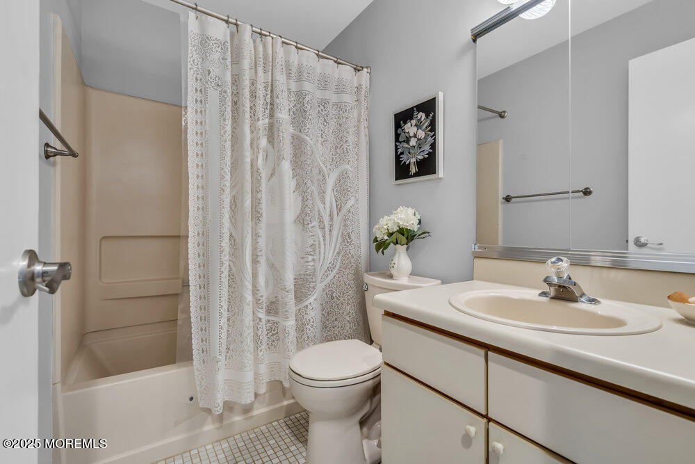 15 Rita Drive Howell, NJ 07731 - Photo 17 of 26 a bathroom with a sink toilet and shower