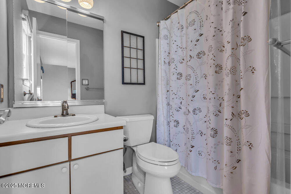 15 Rita Drive Howell, NJ 07731 - Photo 22 of 26 a bathroom with a sink toilet and mirror