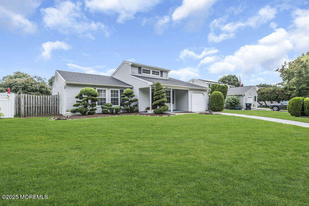 15 Rita Drive Howell, NJ 07731 - Photo 3 of 26 a front view of a house with garden