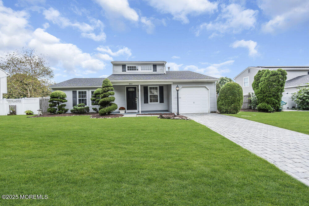 15 Rita Drive Howell, NJ 07731 - Photo 4 of 26 a front view of a house with a yard