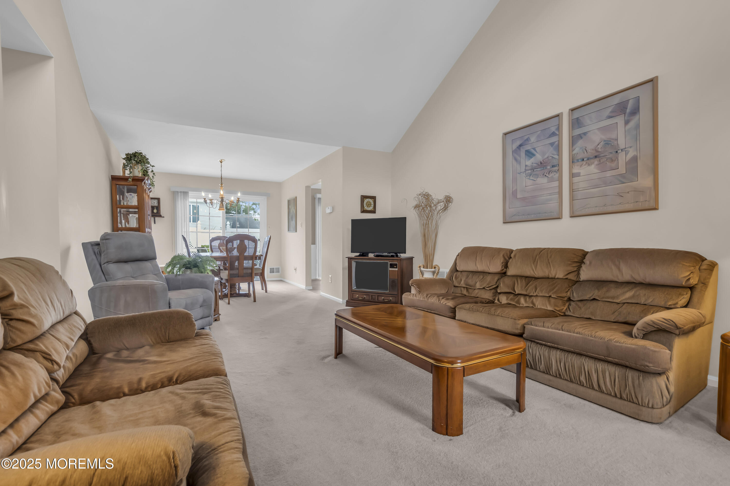 15 Rita Drive Howell, NJ 07731 - Photo 6 of 26 a living room with furniture and a fireplace
