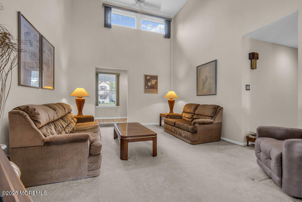 15 Rita Drive Howell, NJ 07731 - Photo 7 of 26 a living room with furniture and a lamp