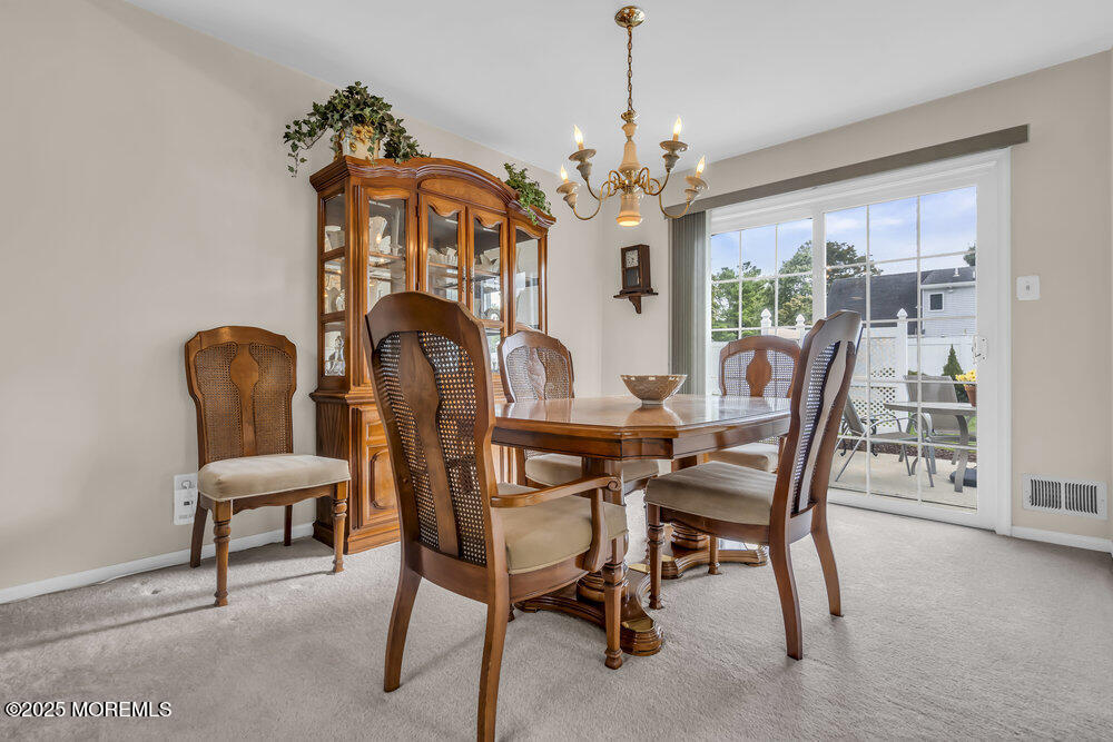15 Rita Drive Howell, NJ 07731 - Photo 10 of 26 a view of a dining room with furniture window and outside view
