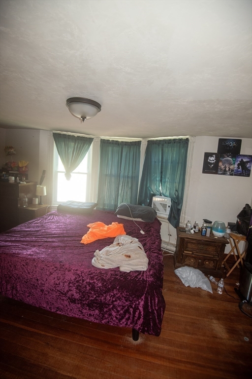 920 Worcester Road Barre, MA 01005 - Photo 37 of 40 a bed sitting in a room next to a window