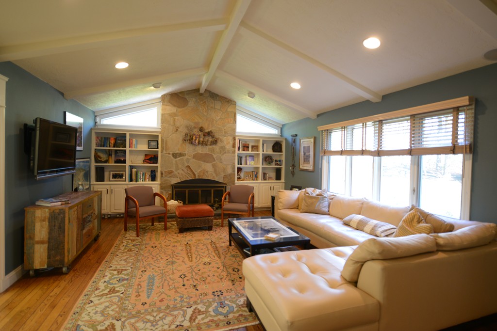 61 Dean Road Weston, MA 02493 - Photo 7 of 10 a living room with furniture fireplace and a flat screen tv