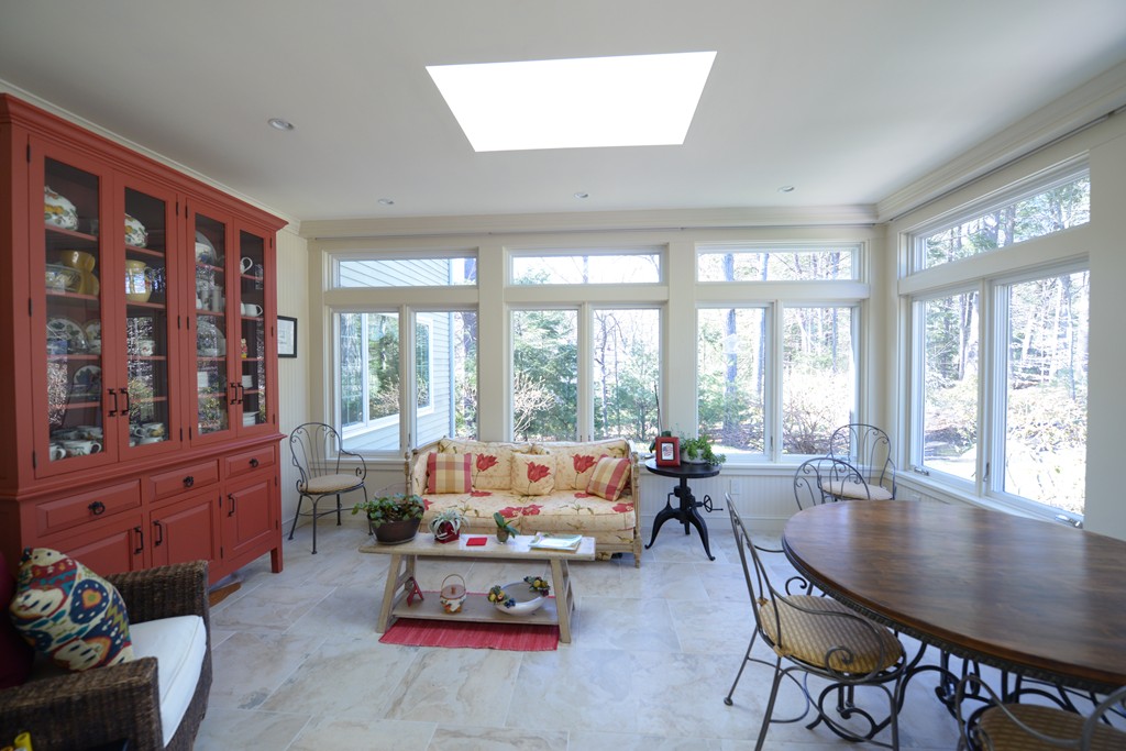 61 Dean Road Weston, MA 02493 - Photo 8 of 10 a living room with furniture and a large window
