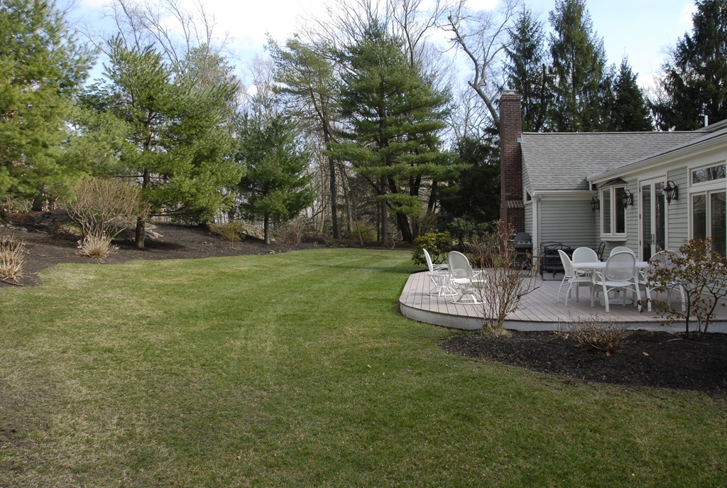 61 Dean Road Weston, MA 02493 - Photo 9 of 10 a view of a house with backyard and sitting area