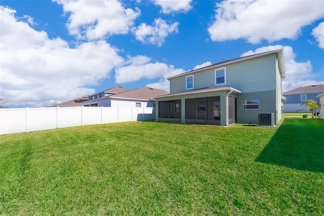 a view of a house with a back yard