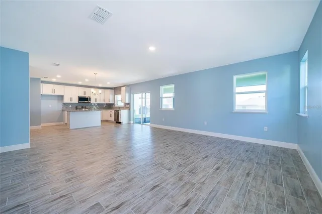 a view of a kitchen with a sink and a window