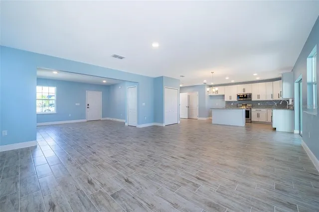 a view of kitchen with wooden floor