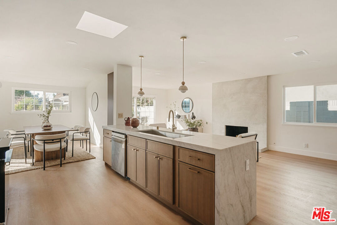 1525 Rogue Street Placentia, CA 92870 - Photo 14 of 40 a kitchen with appliances a sink a counter top space and cabinets