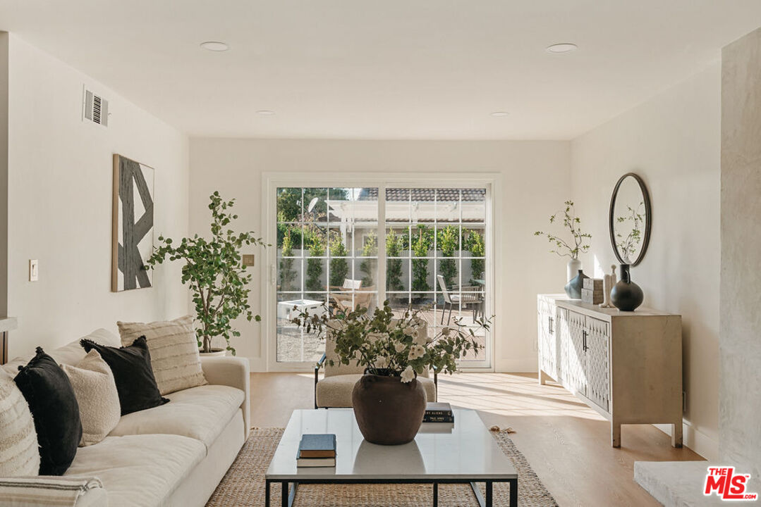 1525 Rogue Street Placentia, CA 92870 - Photo 18 of 40 a living room with furniture potted plant and a large window