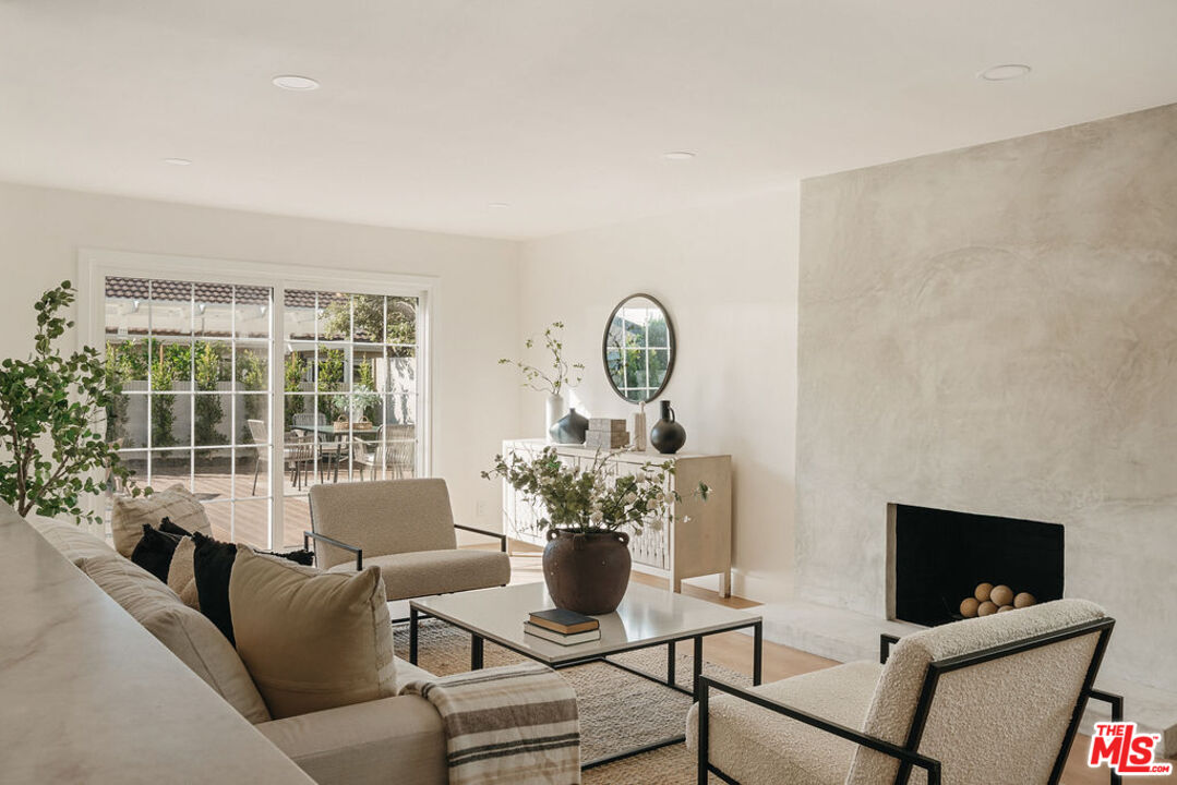 1525 Rogue Street Placentia, CA 92870 - Photo 19 of 40 a living room with furniture a flat screen tv and a window