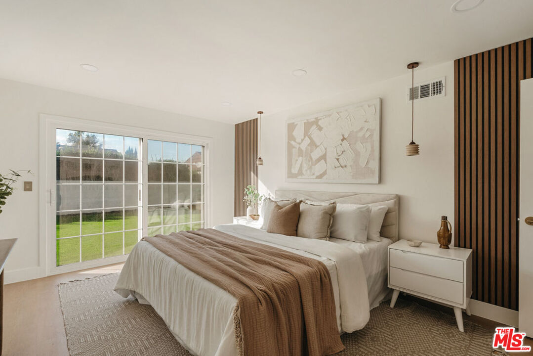 1525 Rogue Street Placentia, CA 92870 - Photo 26 of 40 a bedroom with a large bed and a window