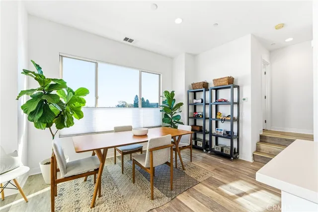 a workspace with furniture and a potted plant