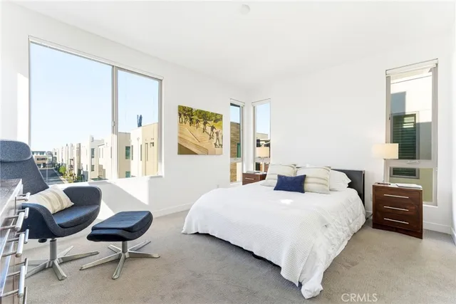 a bedroom with a bed and a couch