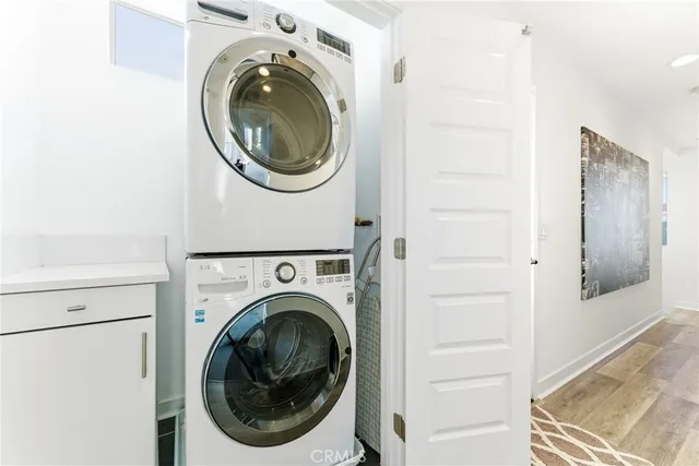 a view of a hallway with washer and dryer