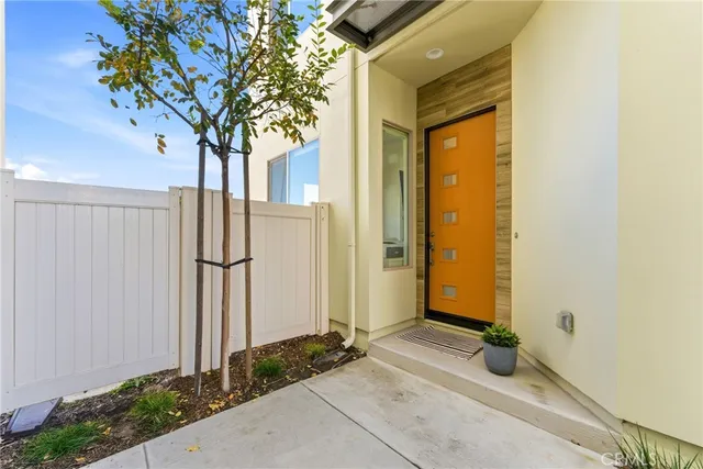 a front view of a house with trees