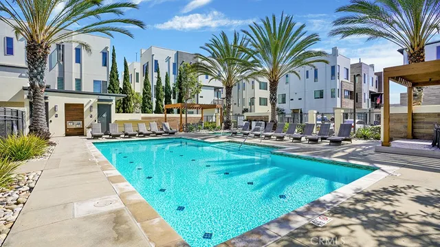 a view of a swimming pool with a table and chairs