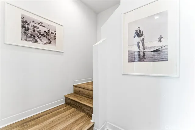 a view of a hallway with paintings on the wall