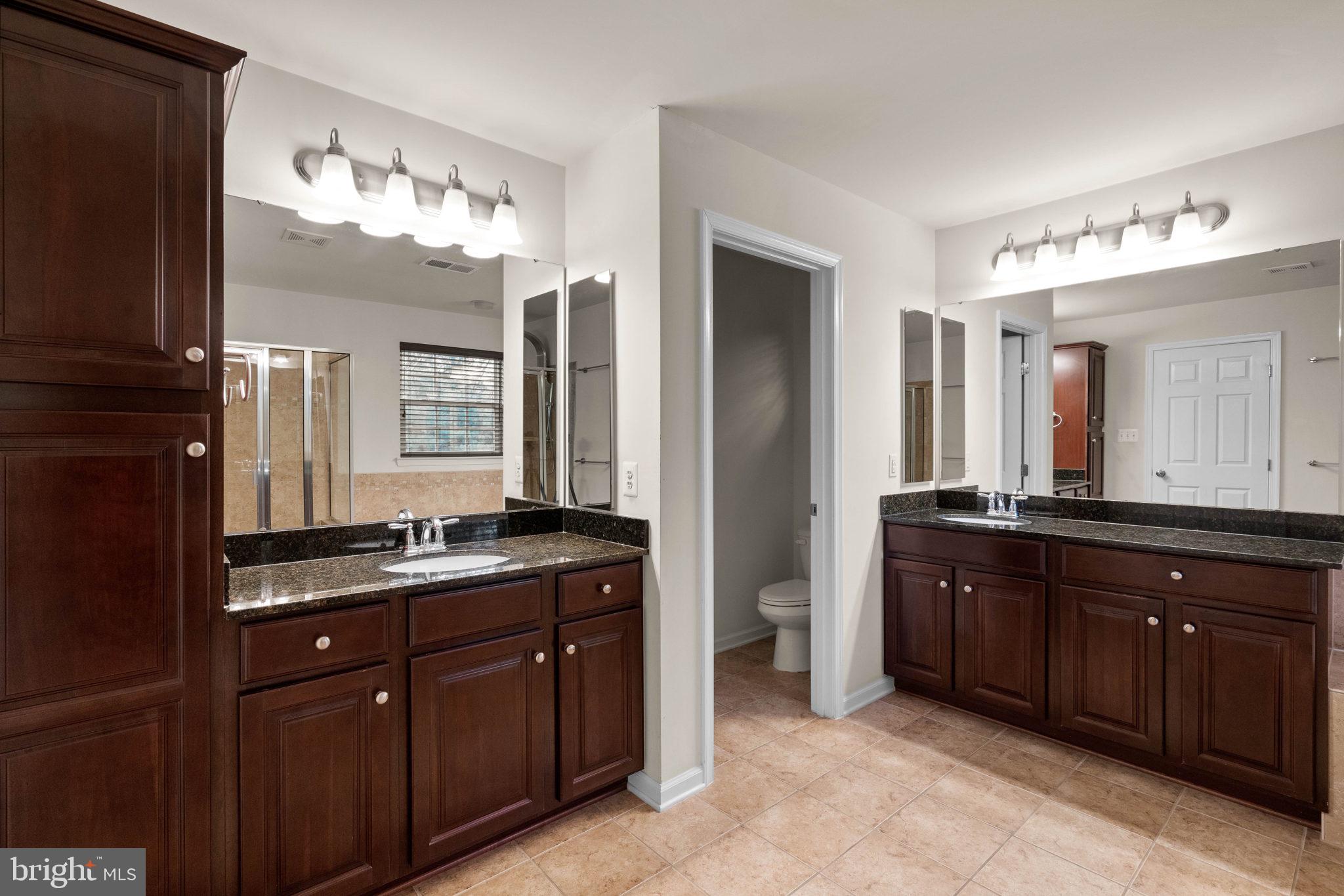 3614 Coatesly Drive Chantilly, VA 20151 - Photo 27 of 51 a spacious bathroom with a granite countertop double vanity sink a mirror and a shower