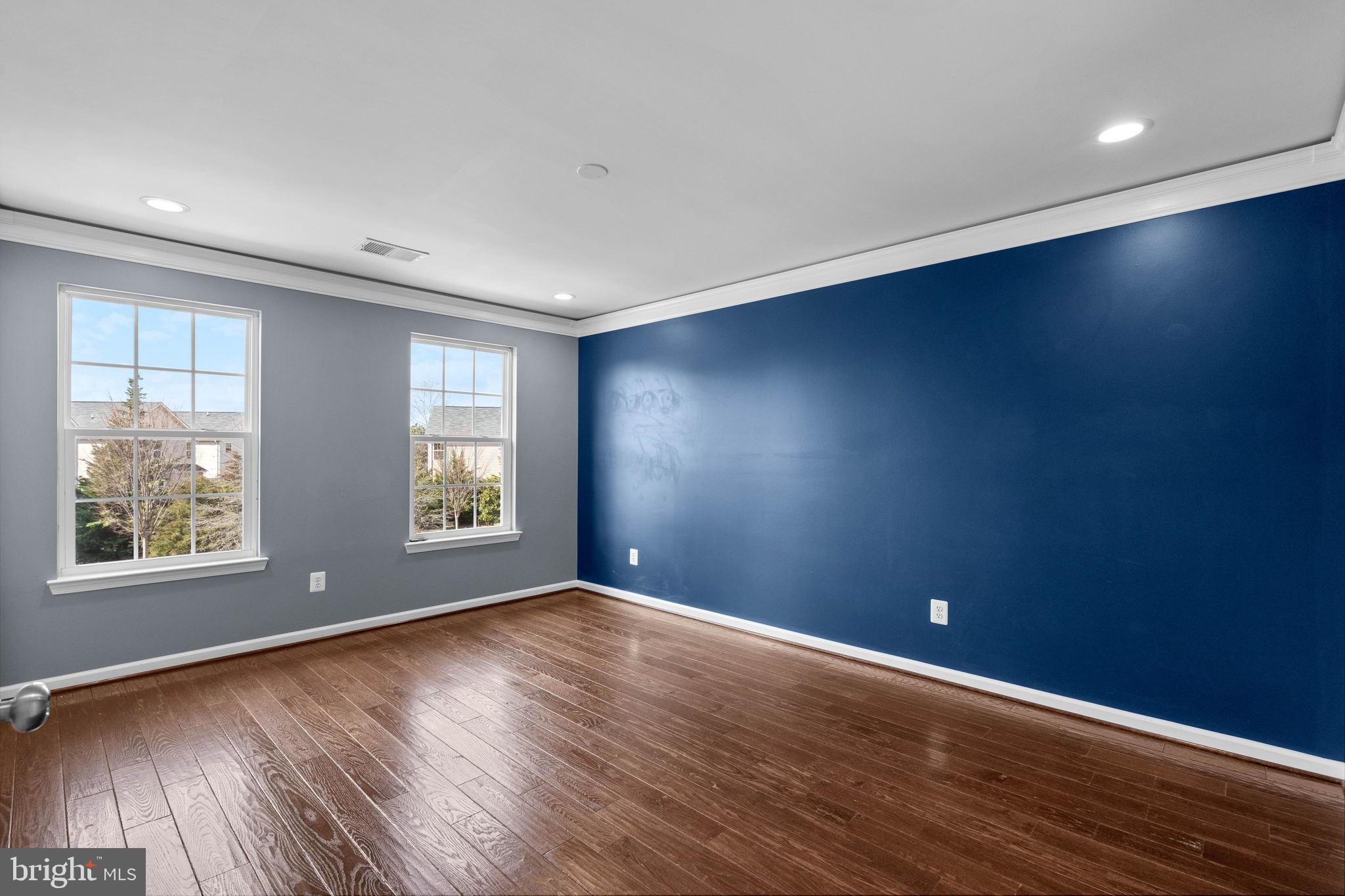 3614 Coatesly Drive Chantilly, VA 20151 - Photo 30 of 51 an empty room with wooden floor and windows