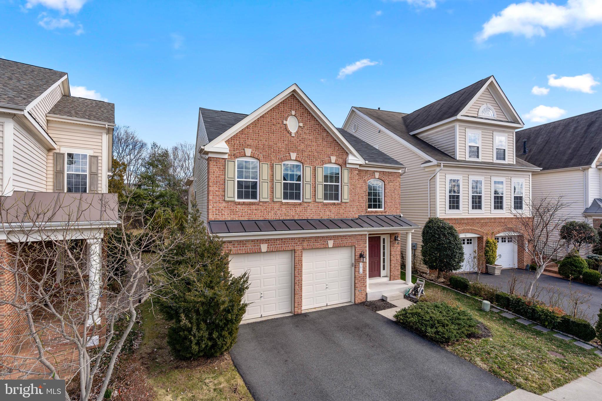 3614 Coatesly Drive Chantilly, VA 20151 - Photo 3 of 51 a front view of a house with a yard and garage