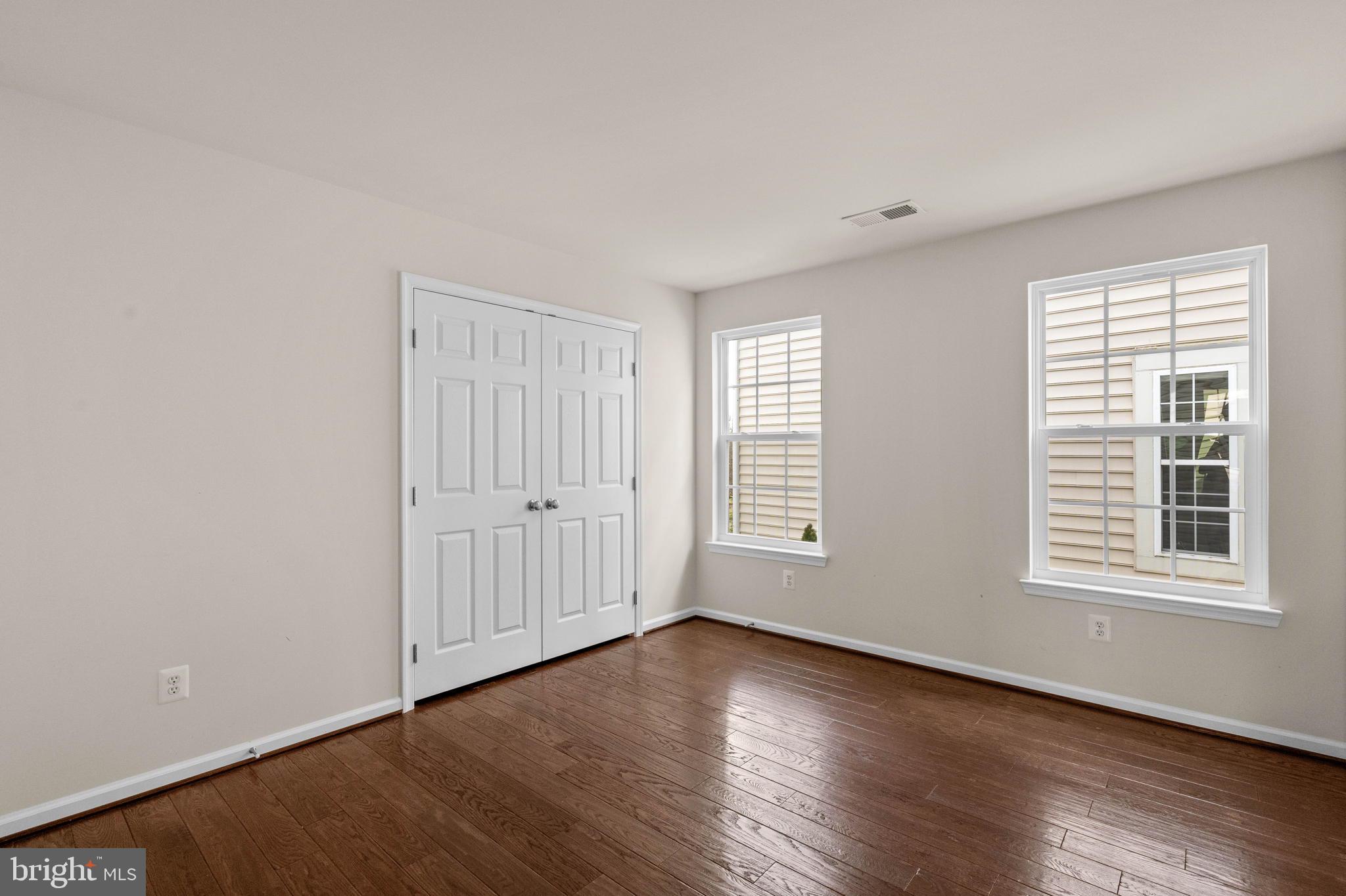 3614 Coatesly Drive Chantilly, VA 20151 - Photo 36 of 51 an empty room with wooden floor and windows