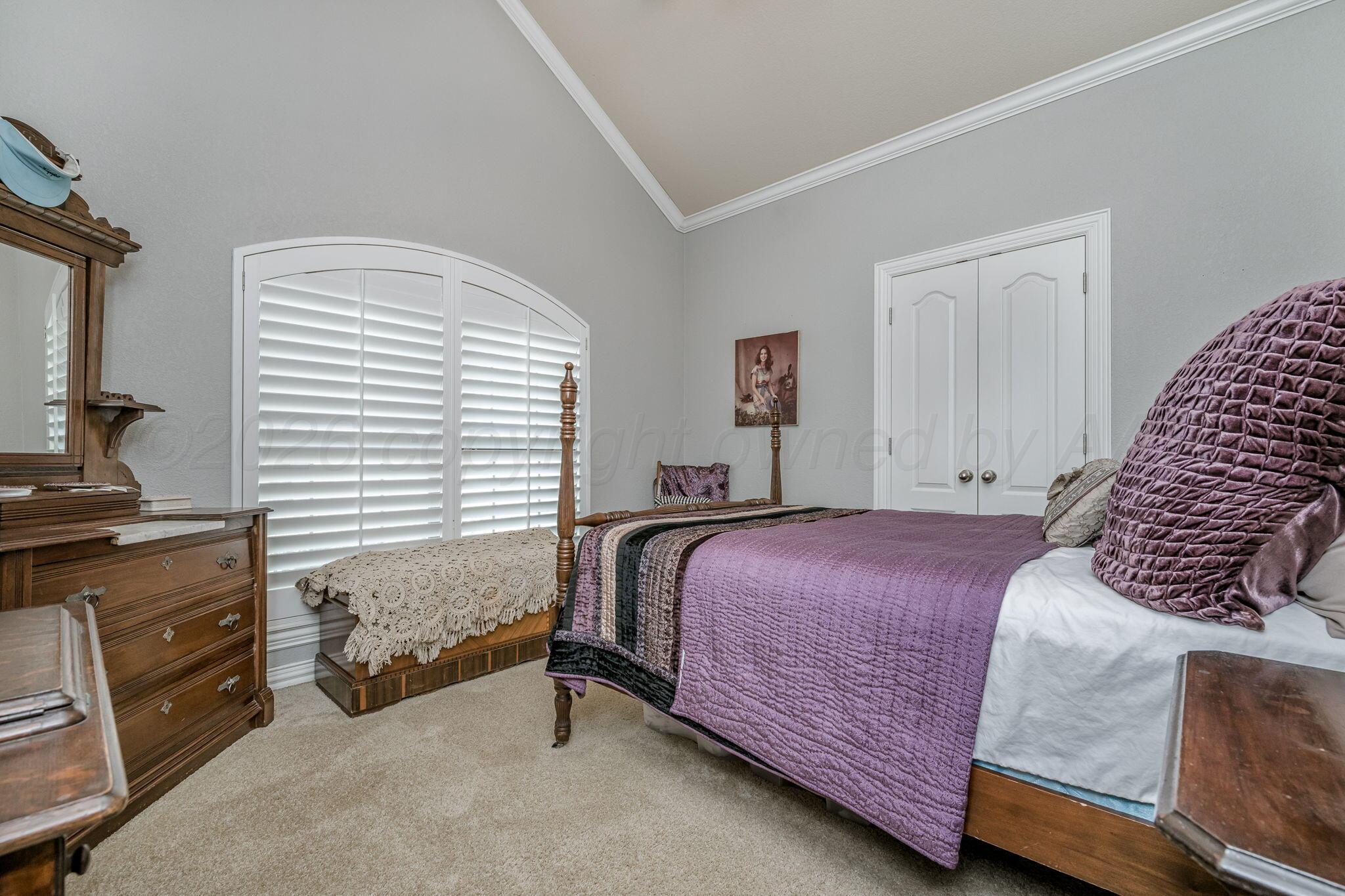 6007 Hunter Drive Amarillo, TX 79119 - Photo 20 of 28 a bedroom with a bed and a dresser