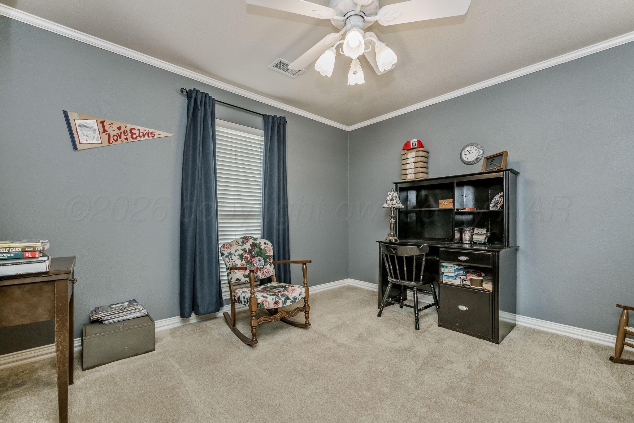 6007 Hunter Drive Amarillo, TX 79119 - Photo 21 of 28 a view of a livingroom with workspace and a window