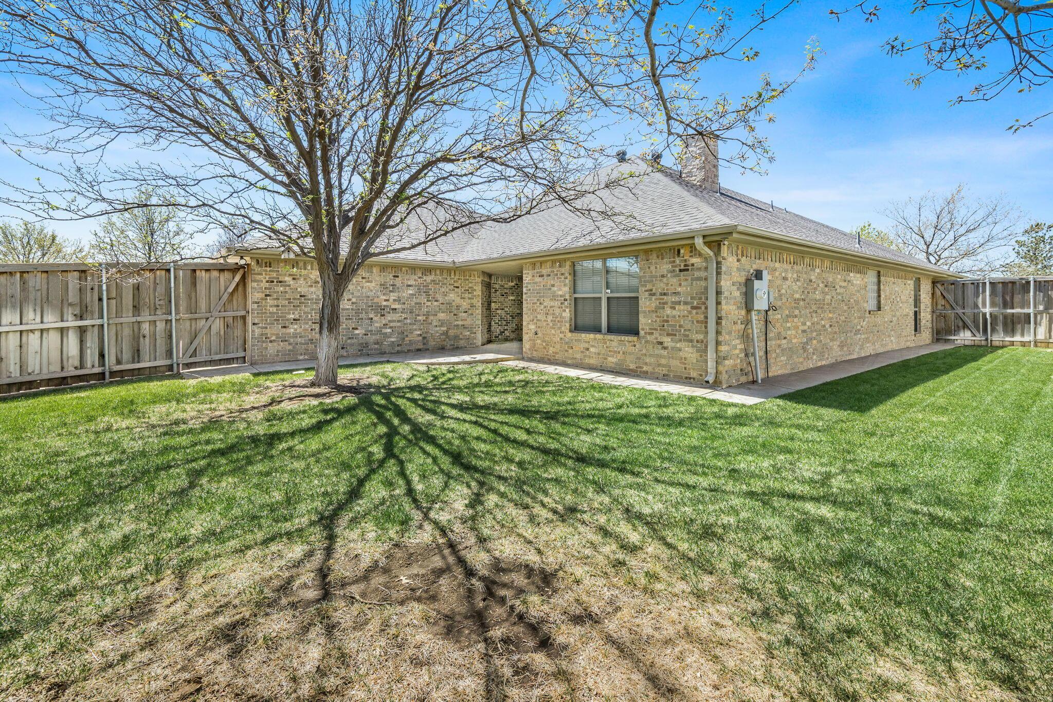 6007 Hunter Drive Amarillo, TX 79119 - Photo 27 of 28 a view of a house with a yard