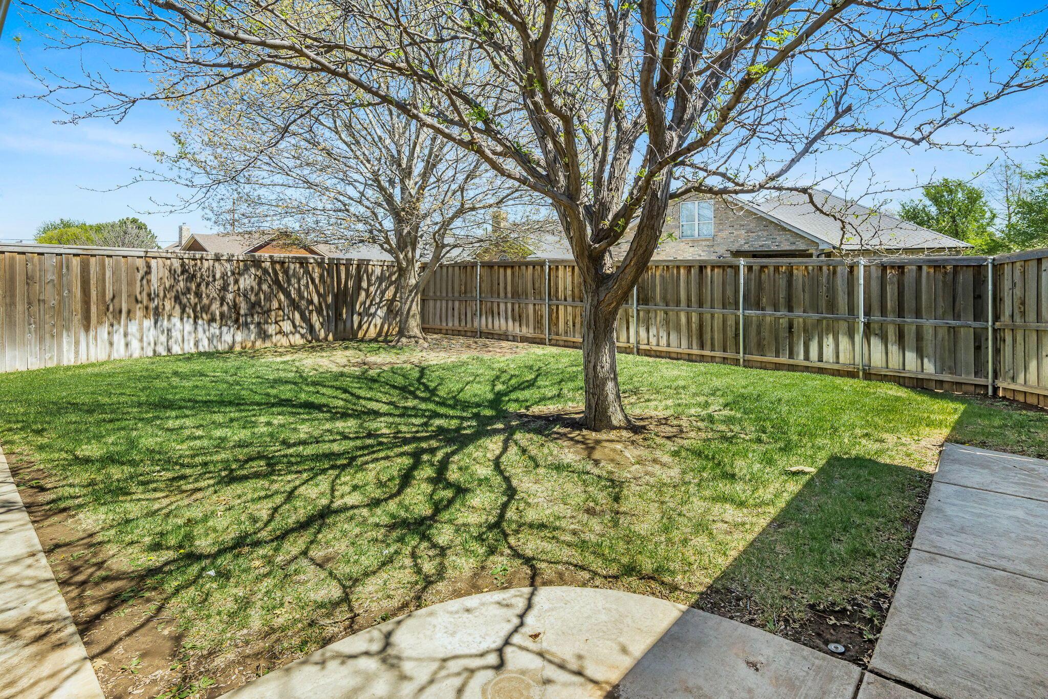 6007 Hunter Drive Amarillo, TX 79119 - Photo 28 of 28 a backyard of a house with lots of green space