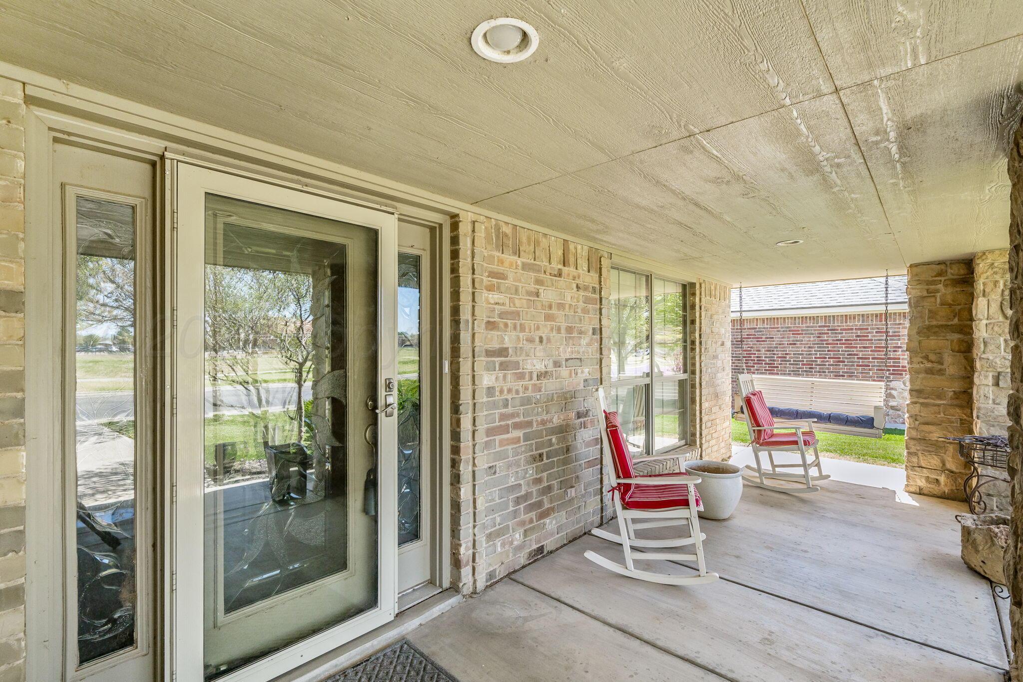 6007 Hunter Drive Amarillo, TX 79119 - Photo 3 of 28 a living room with furniture and a floor to ceiling window
