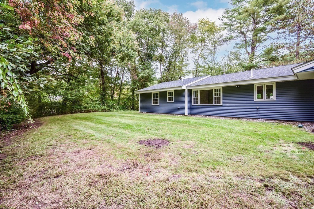 26 Juniper Lane Framingham, MA 01701 - Photo 23 of 26 a view of a house with a backyard