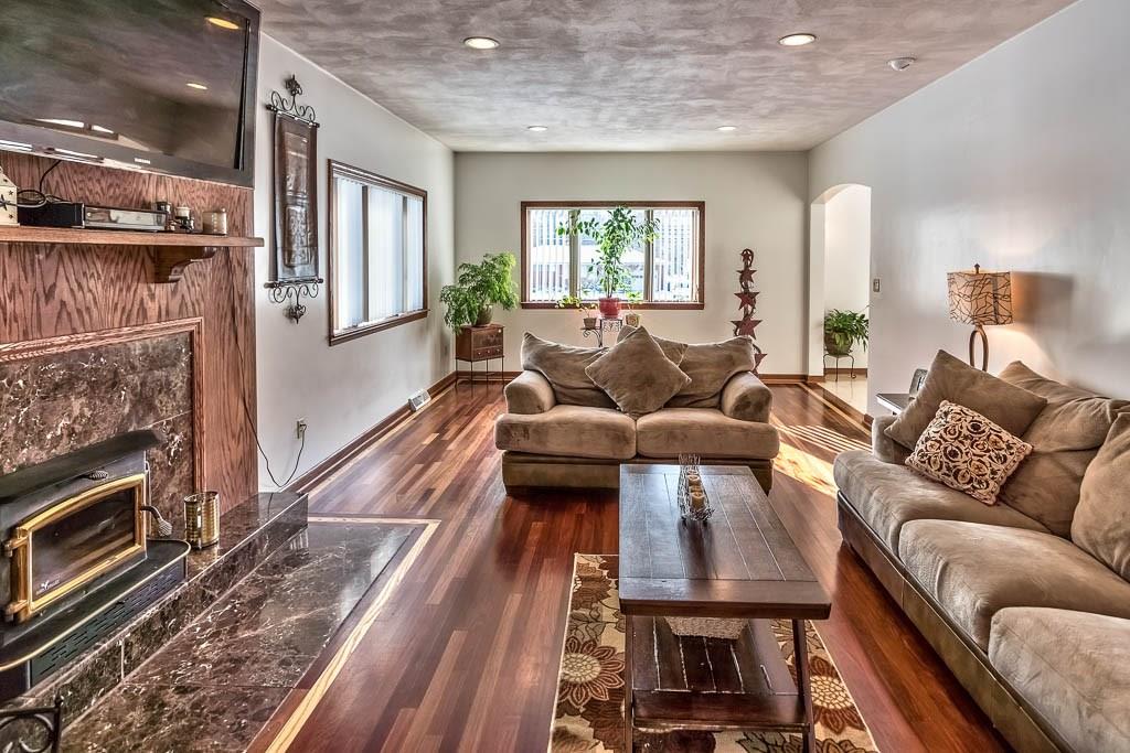 645 Field Club Road Pittsburgh, PA 15238 - Photo 4 of 25 The living room is an inviting area with its exotic flooring and gorgeous fireplace!