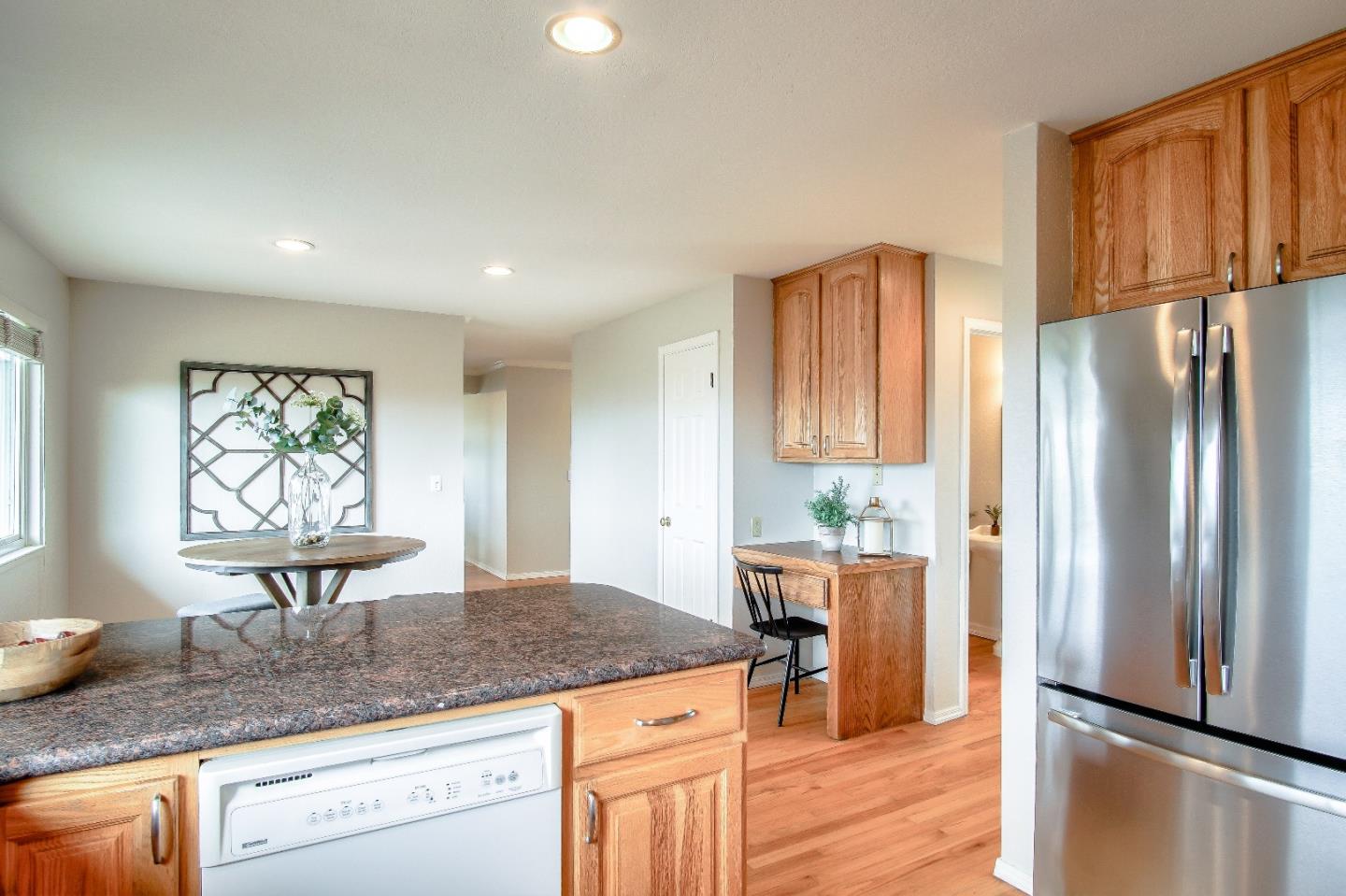 2740 Thomas Grde Morgan Hill, CA 95037 - Photo 27 of 67 a kitchen with stainless steel appliances granite countertop a refrigerator and a stove top oven