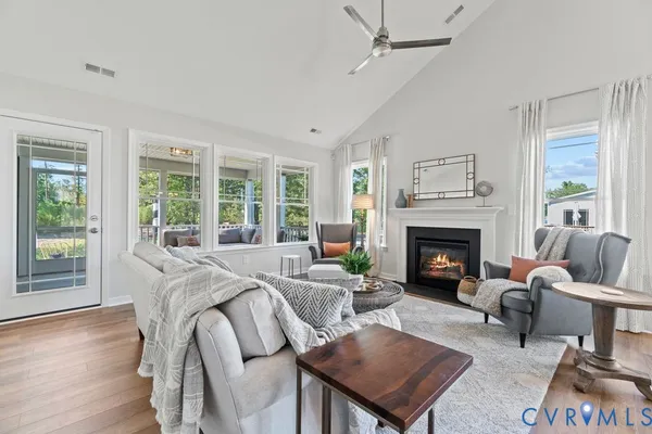 a living room with furniture and a fireplace