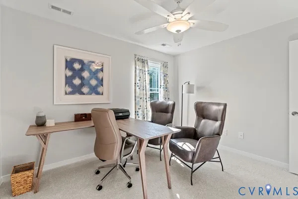 a view of a livingroom with furniture and a chandelier