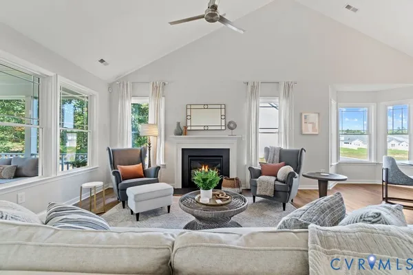 a living room with furniture and a fireplace