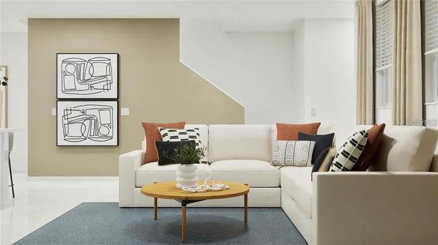 a living room with furniture and a window