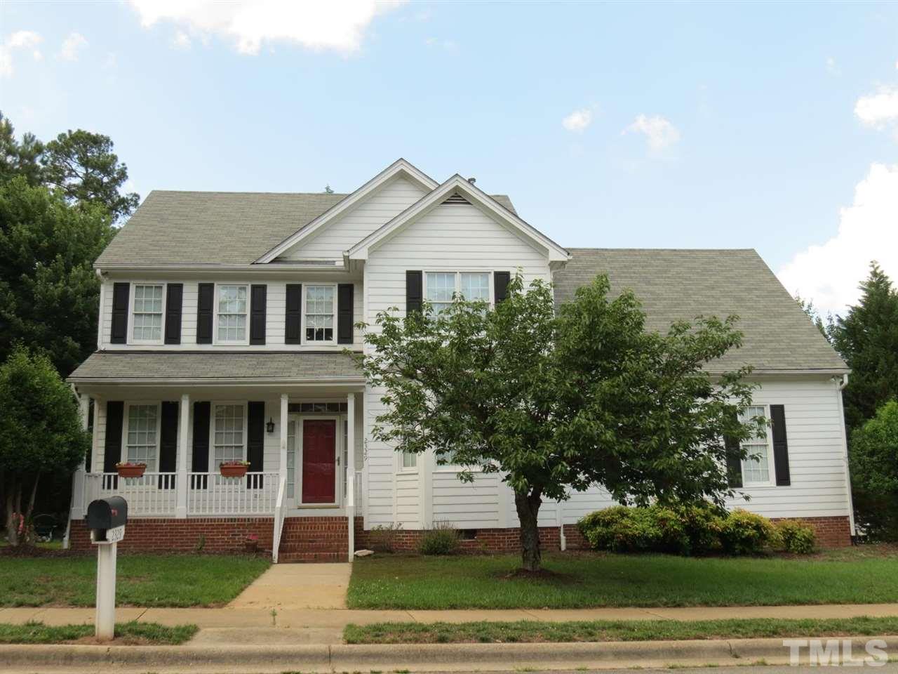 2329 Finley Ridge Lane Raleigh, NC 27615 - Photo 1 of 27 a front view of a house with a yard